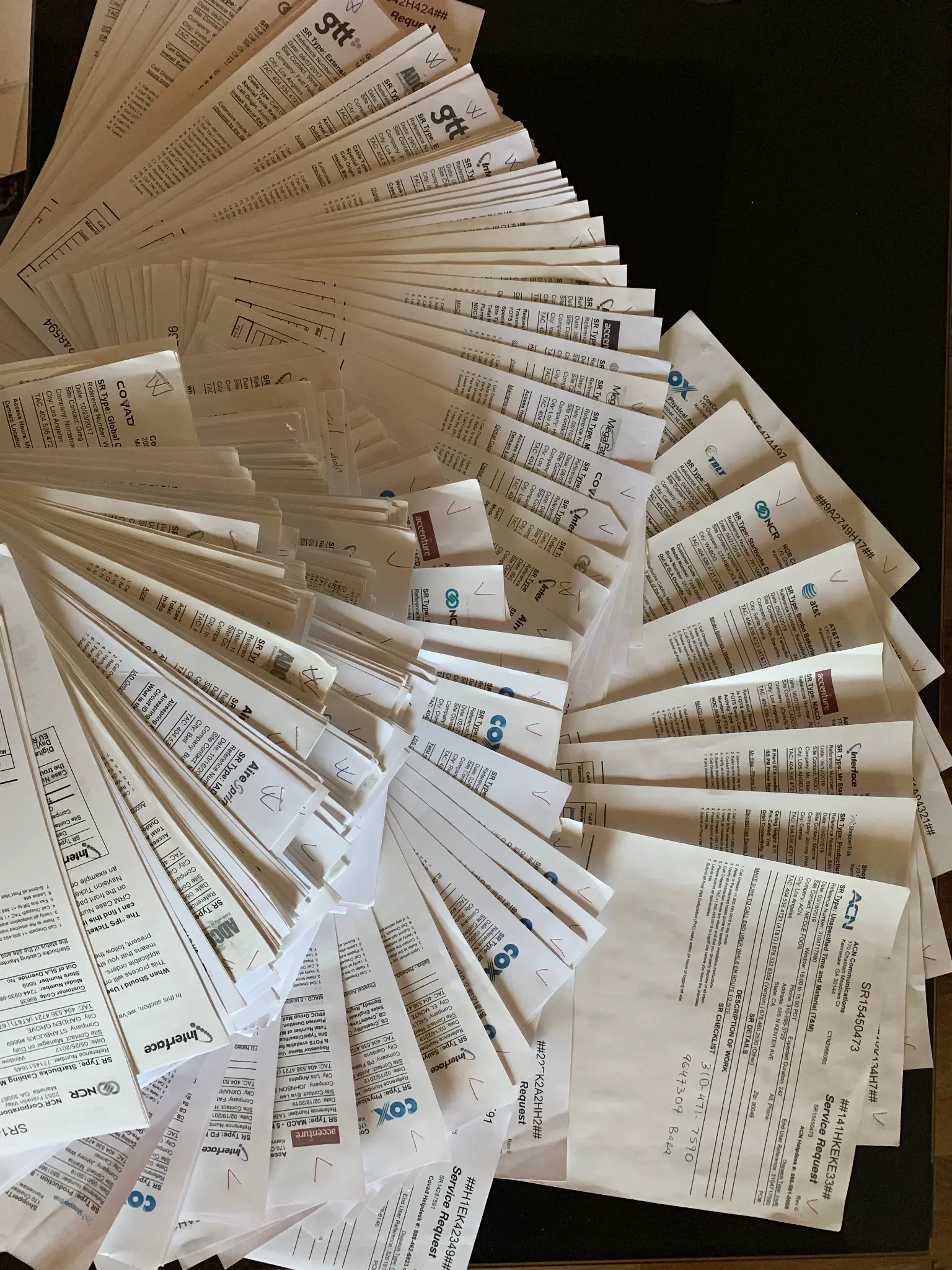 Stack of completed work orders and service requests